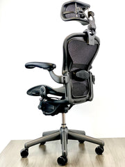 Herman Miller Aeron - Size: A - w/ Headrest for Users 5' 10" and Over - Black/Black - Fully Featured w/ Fully Adjustable Arms - Certified Pre-Owned