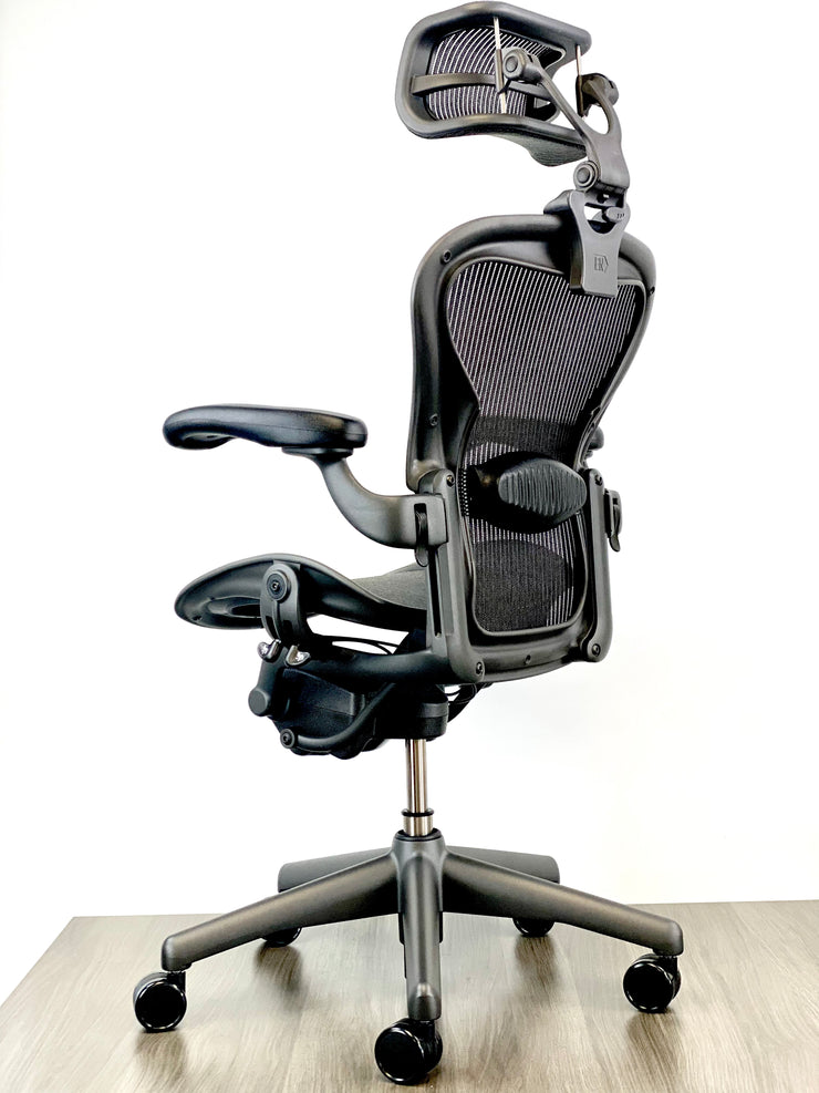 Herman Miller Aeron - Size: A - w/ Headrest for Users 5' 10" and Over - Black/Black - Fully Featured w/ Fully Adjustable Arms - Certified Pre-Owned