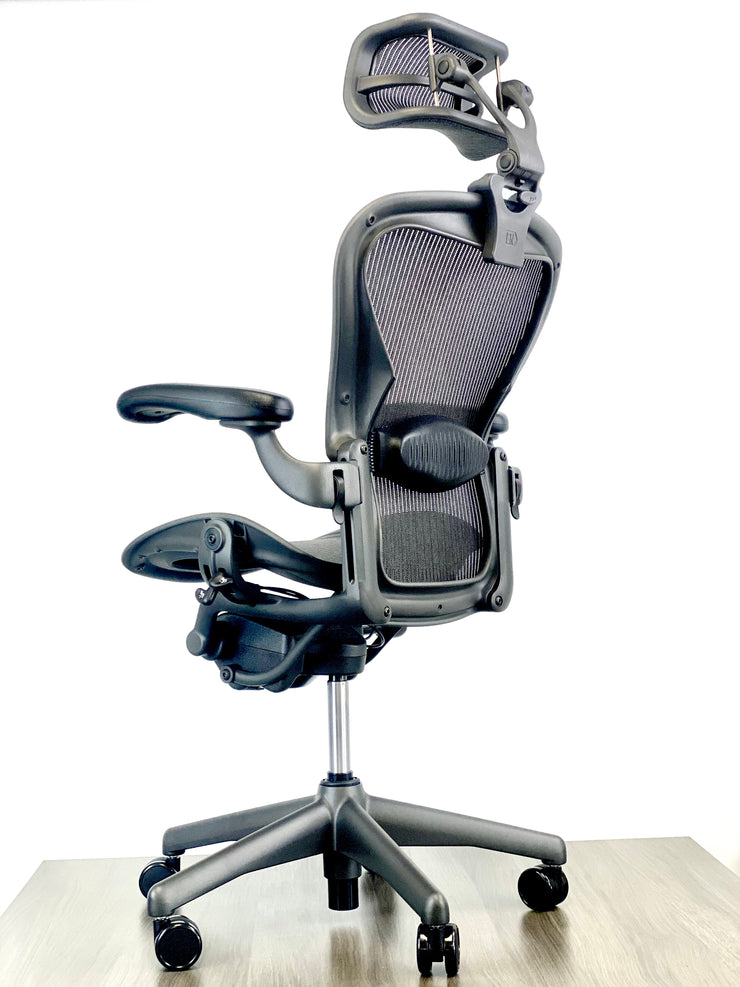Herman Miller Aeron - Size: B - w/ Headrest for Users 5' 10" and Over - Black/Black - Fully Featured w/ Fully Adjustable Arms - Certified Pre-Owned