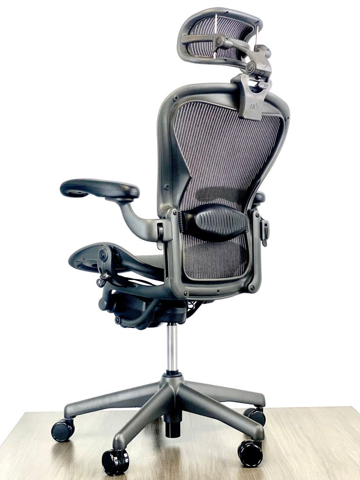Herman Miller Aeron - Size: B - w/ Headrest for Users 5' 10" and Under - Black/Black - Fully Featured w/ Fully Adjustable Arms - Certified Pre-Owned