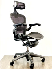 Herman Miller Aeron - Size: A - w/ Headrest for Users 5' 9" and Under - Black/Black - Fully Featured w/ Fully Adjustable Arms - Certified Pre-Owned