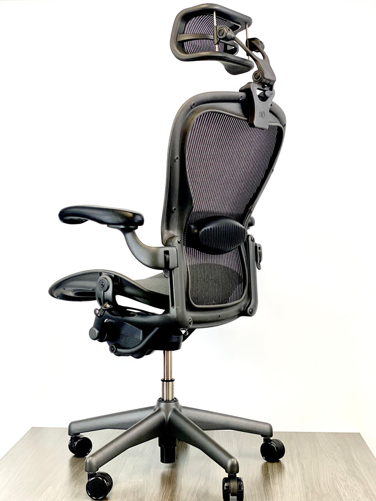 Herman Miller Aeron - Size: C - w/ Headrest for Users 5' 11" and Over - Black/Black - Fully Featured w/ Fully Adjustable Arms - Certified Pre-Owned