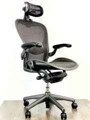 Herman Miller Aeron - Size: C - w/ Headrest for Users 5' 11" and Under - Black/Black - Fully Featured w/ Fully Adjustable Arms - Certified Pre-Owned