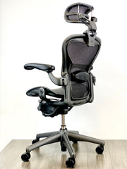 Herman Miller Aeron - Size: A - w/ Headrest for Users 5' 9" and Under - Black/Black - Fully Featured w/ Fully Adjustable Arms - Certified Pre-Owned